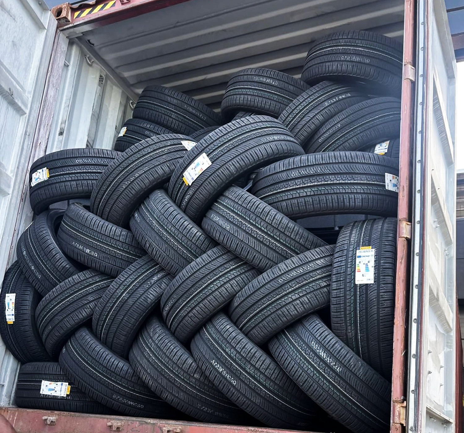 A container trailer fully loaded with new Pirelli tires, ready for shipment
