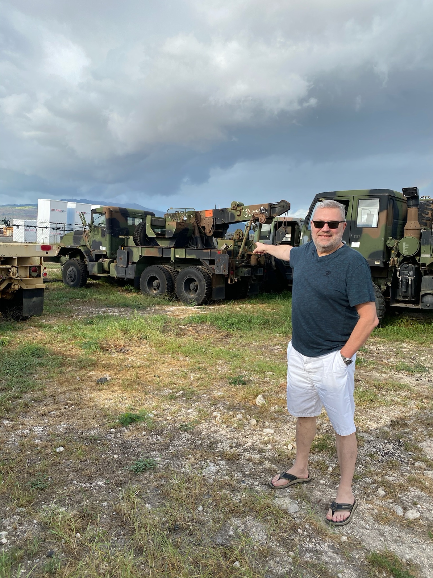 Military heavy-duty wrecker trucks parked in a yard