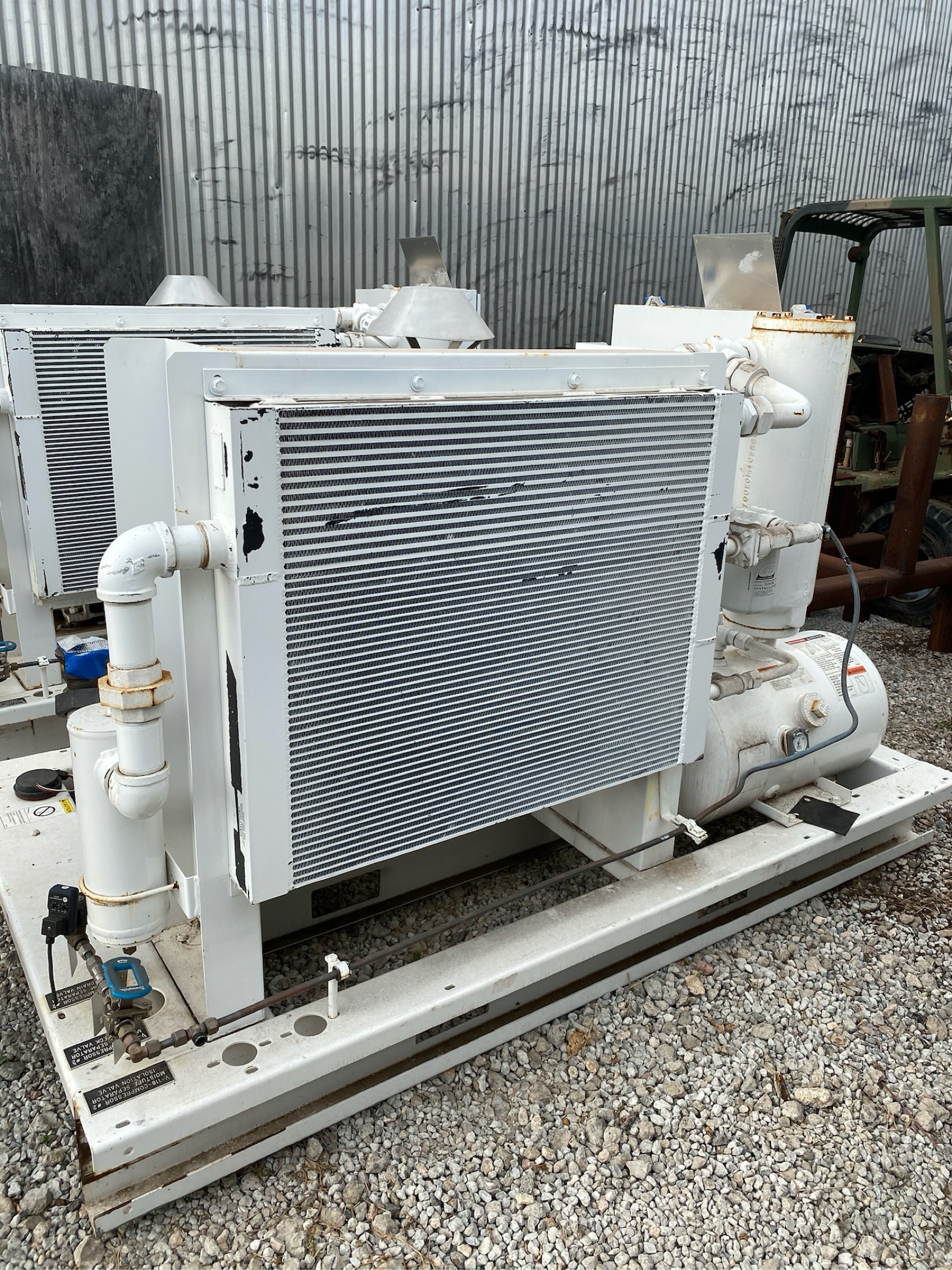 White skid-mounted industrial compressor and cooler unit