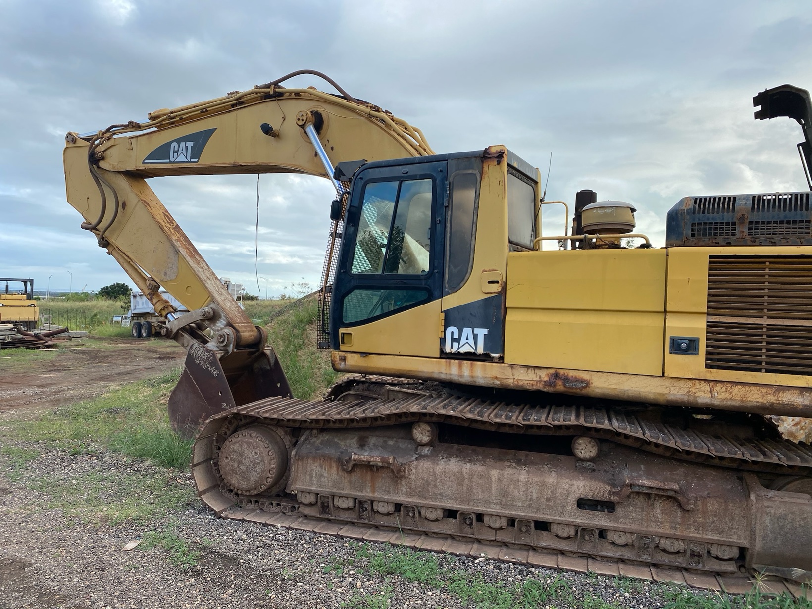 Yellow Caterpillar tracked excavator