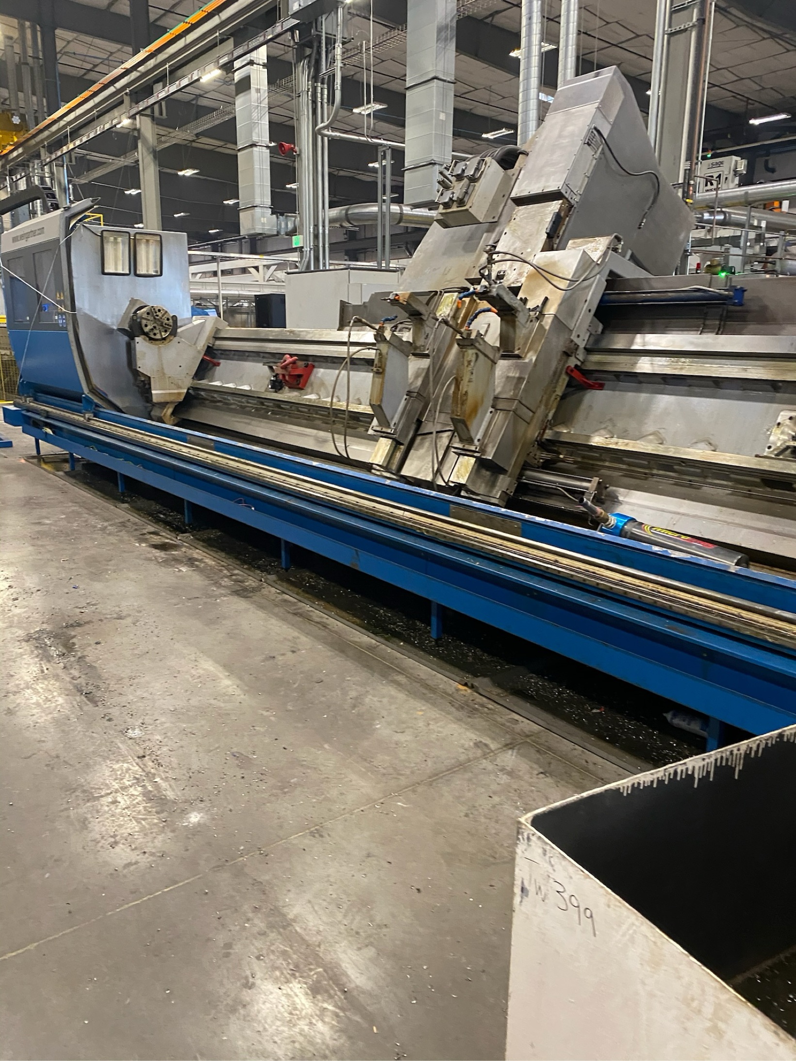 Very large industrial CNC lathe inside a factory hall